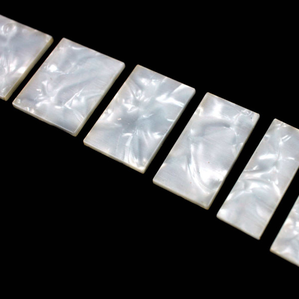 SET OF BLOCK INLAYS FOR J BASS STYLE NECKS - WHITE PEARL PURE CELLULOID SET OF BLOCK INLAYS FOR J BASS STYLE NECKS - WHITE PEARL PURE CELLULOID